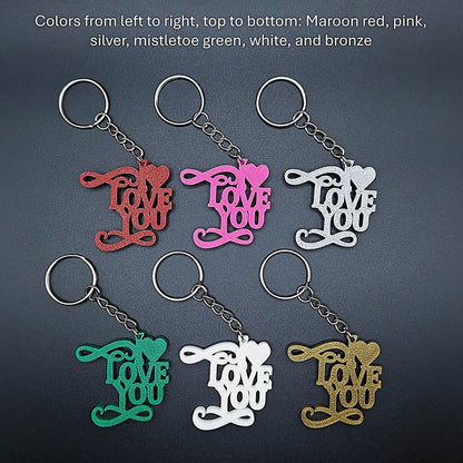 Close-up of six “I ❤️ You” keychains in various shades, eco-friendly plastic charms ideal for gifting love and appreciation all year round.