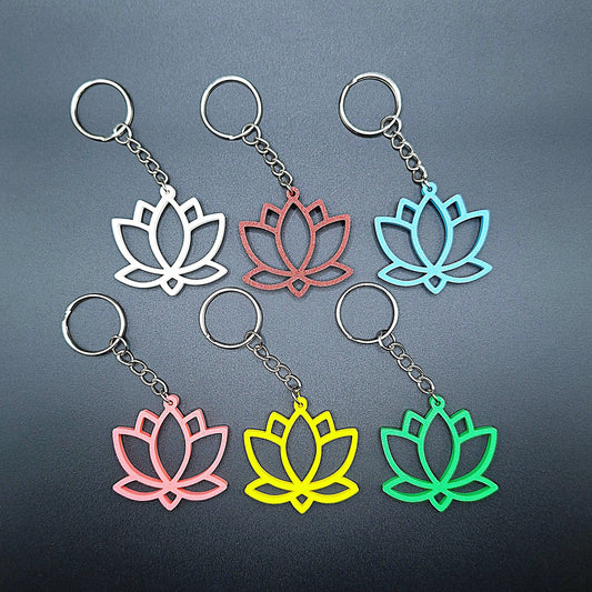 Six lotus flower keychains shown in various vibrant colors, eco-friendly and handmade, perfect for spiritual gifts or mindful accessories.