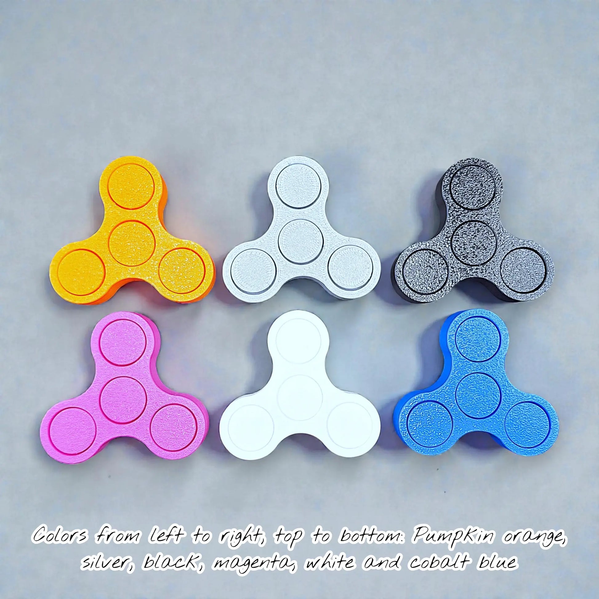 Handmade and customizable smooth fidget spinners in vibrant colors and ideal for quiet, stress-relieving play, anxiety relief and focus.