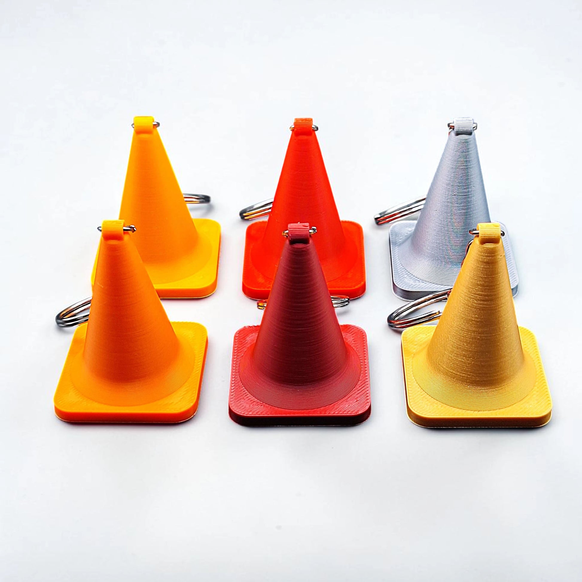 Traffic cone keychains, showing detailed shape and eco PLA material, ideal for gag gifts or themed sets.