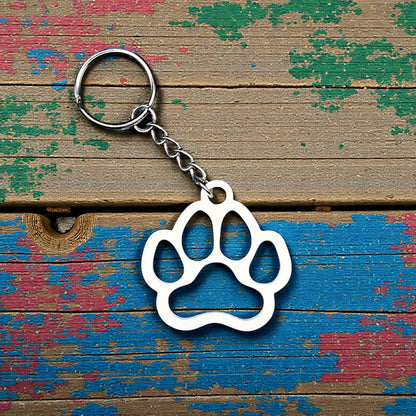 Handmade and customizable paw keychain in white, ideal for honoring pets, gifting to animal lovers, or everyday use.