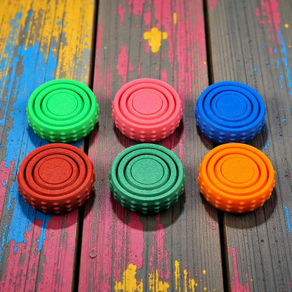 Front view of six colorful pocket fidget spinners, great for anxiety, sensory needs, and focus on the go—compact and eco-conscious design.