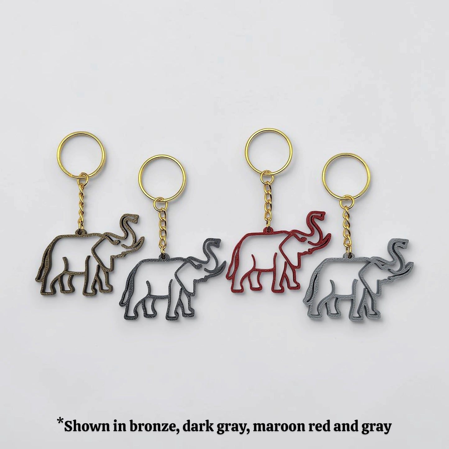 Elephant keychains in various colors with gold keyrings, perfect for classroom prizes, party favors for kids birthdays, baby showers and unique stocking stuffers.