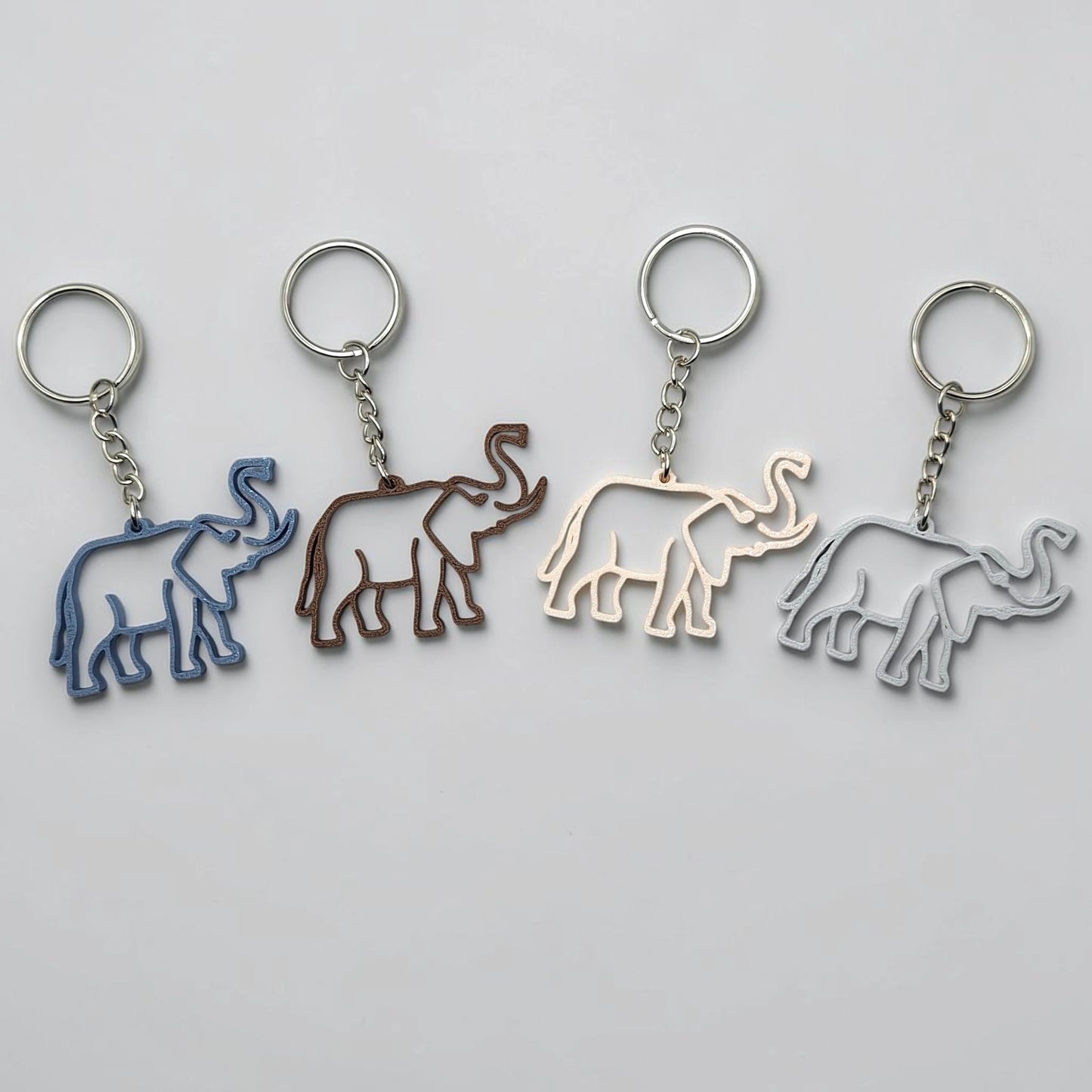 Safari elephant keychains with silver keyrings, perfect for classroom prizes, party favors for kids birthdays, baby showers and unique stocking stuffers.