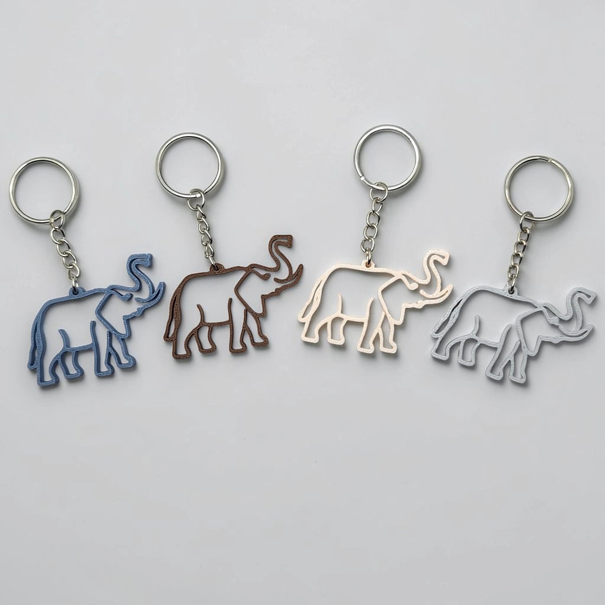 Safari elephant keychains with silver keyrings, perfect for classroom prizes, party favors for kids birthdays, baby showers and unique stocking stuffers.