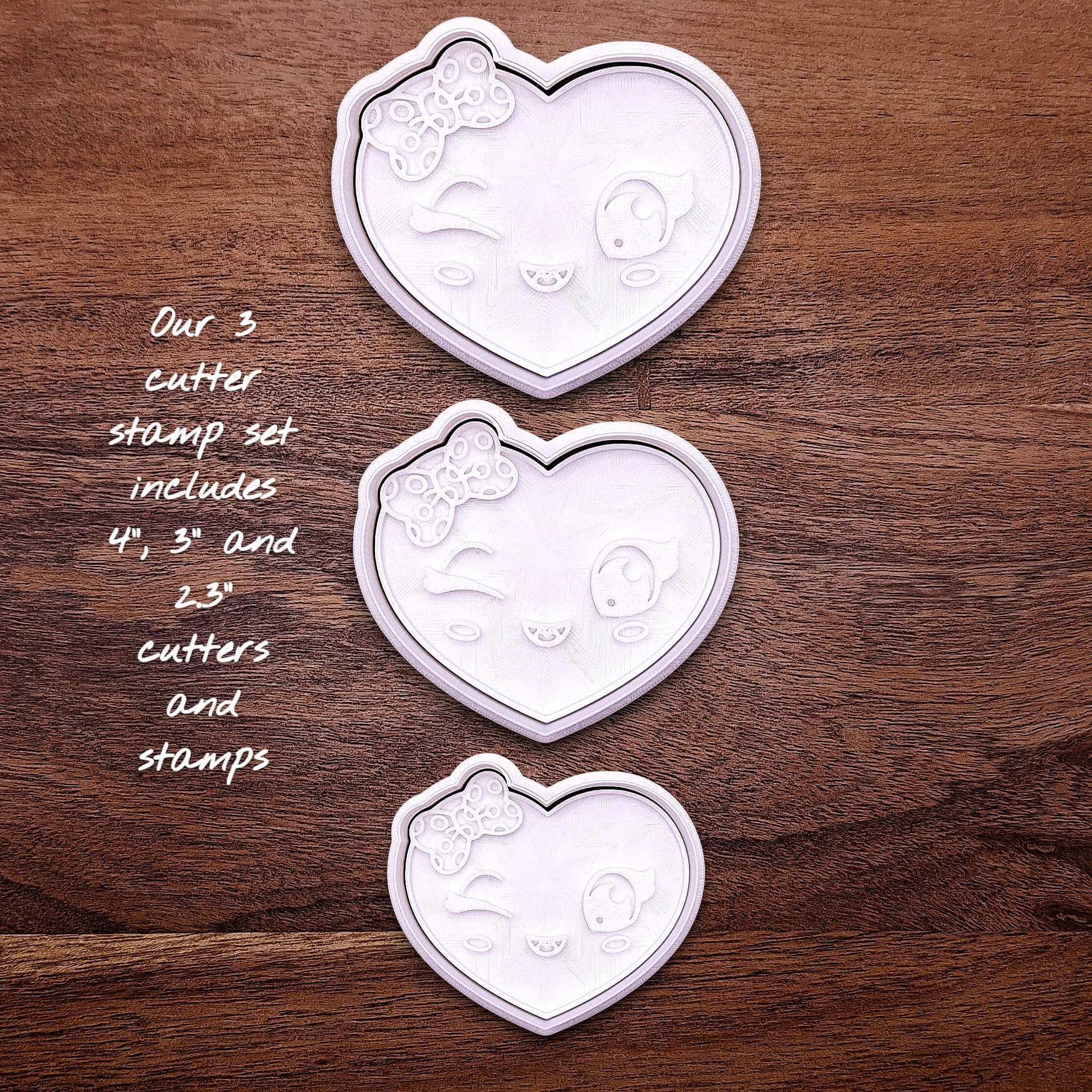 Heart cookie cutter set with matching stamps — features cute winking face and bow design for sweet custom cookies.