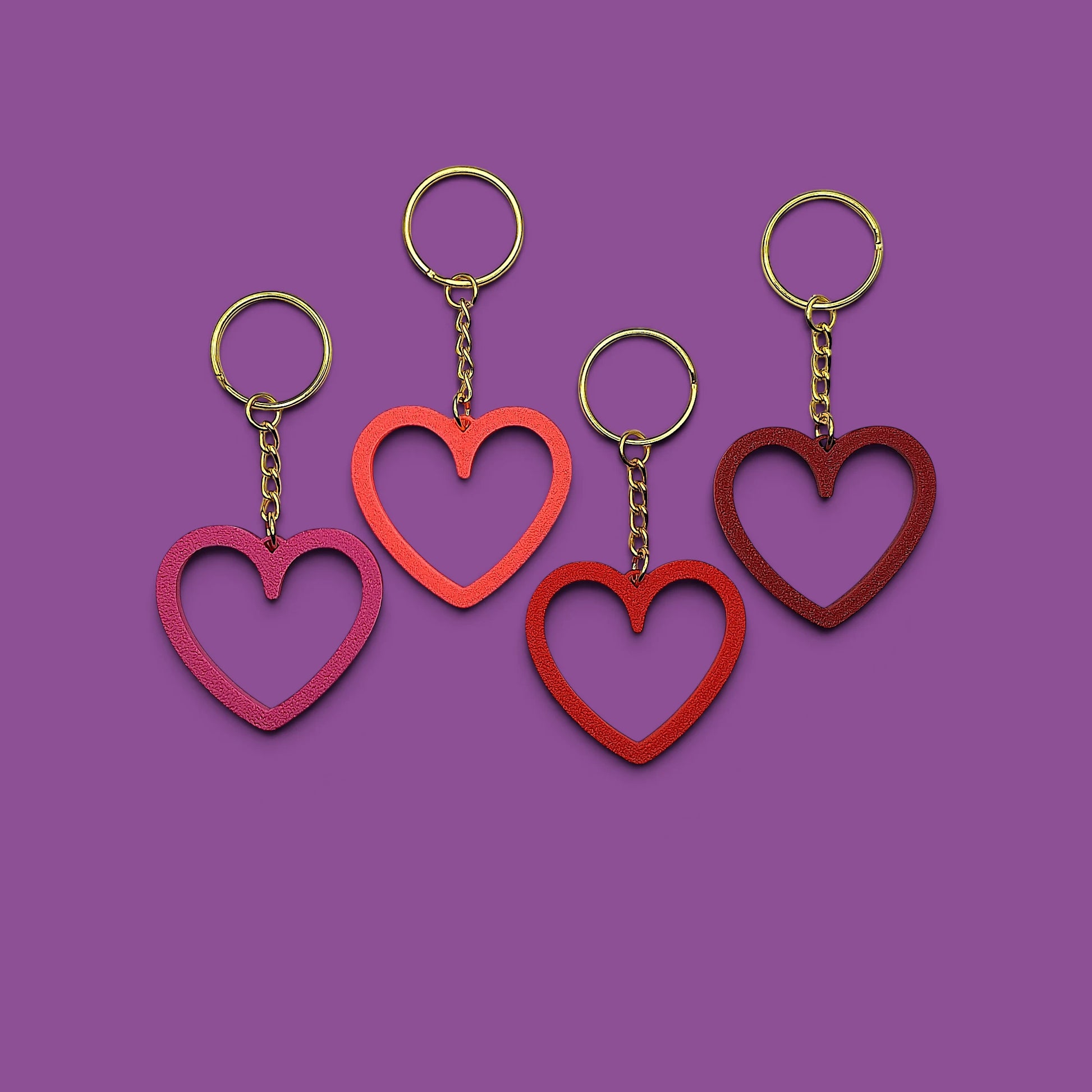 Heart keychains with gold keyrings, perfect for Valentine's Day gifts, wedding party favors, stocking stuffers and class prizes.