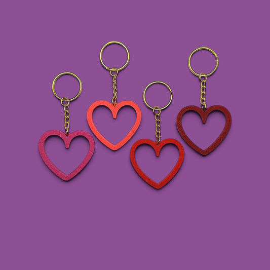 Heart keychains with gold keyrings, perfect for Valentine's Day gifts, wedding party favors, stocking stuffers and class prizes.