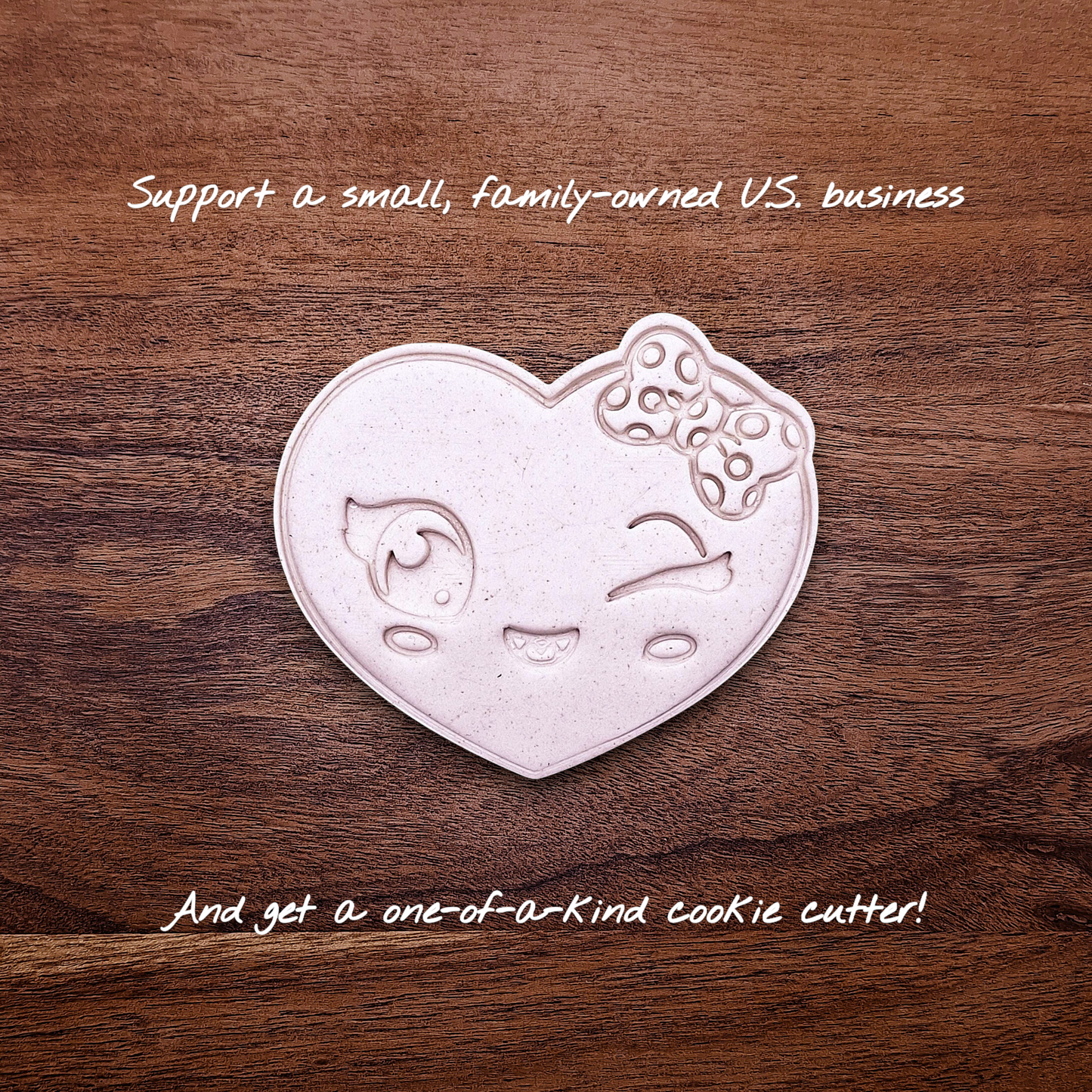 Heart cookie cutter dough cutout with smiley face imprint, perfect for Valentine’s Day cookies, wedding favors, and fun DIY baking projects.