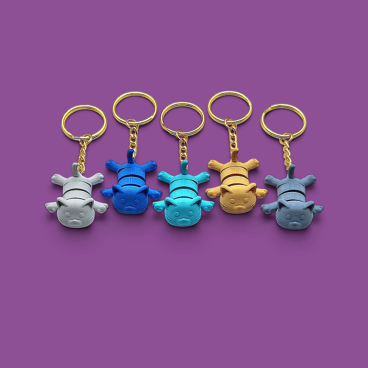 Cat keychains in assorted colors, customizable and handmade, perfect for classroom prizes, party favors and event giveaways.