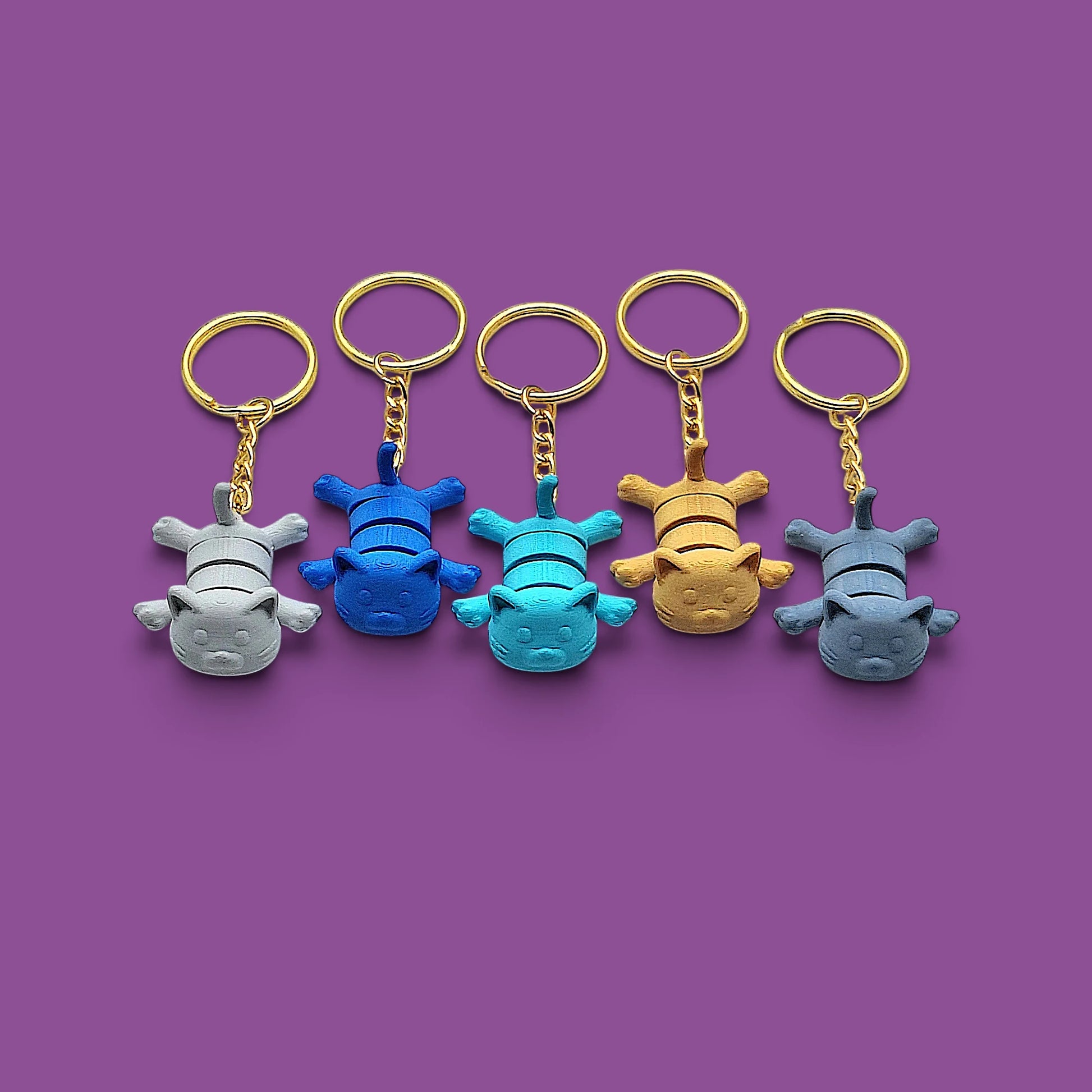 Cat keychains in assorted colors, customizable and handmade, perfect for classroom prizes, party favors and event giveaways.
