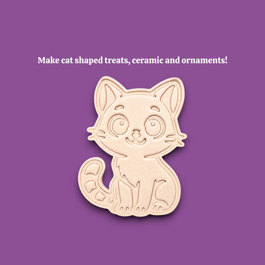 A light gray cat-shaped cookie cutter or mold centered on a solid purple background, with white text above reading 'Make cat shaped treats, ceramics and ornaments!'.
