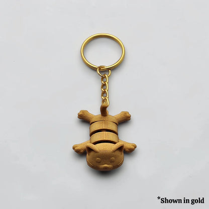 Articulated cat keychain in gold, customizable and handmade, perfect for classroom prizes, party favors and event giveaways.