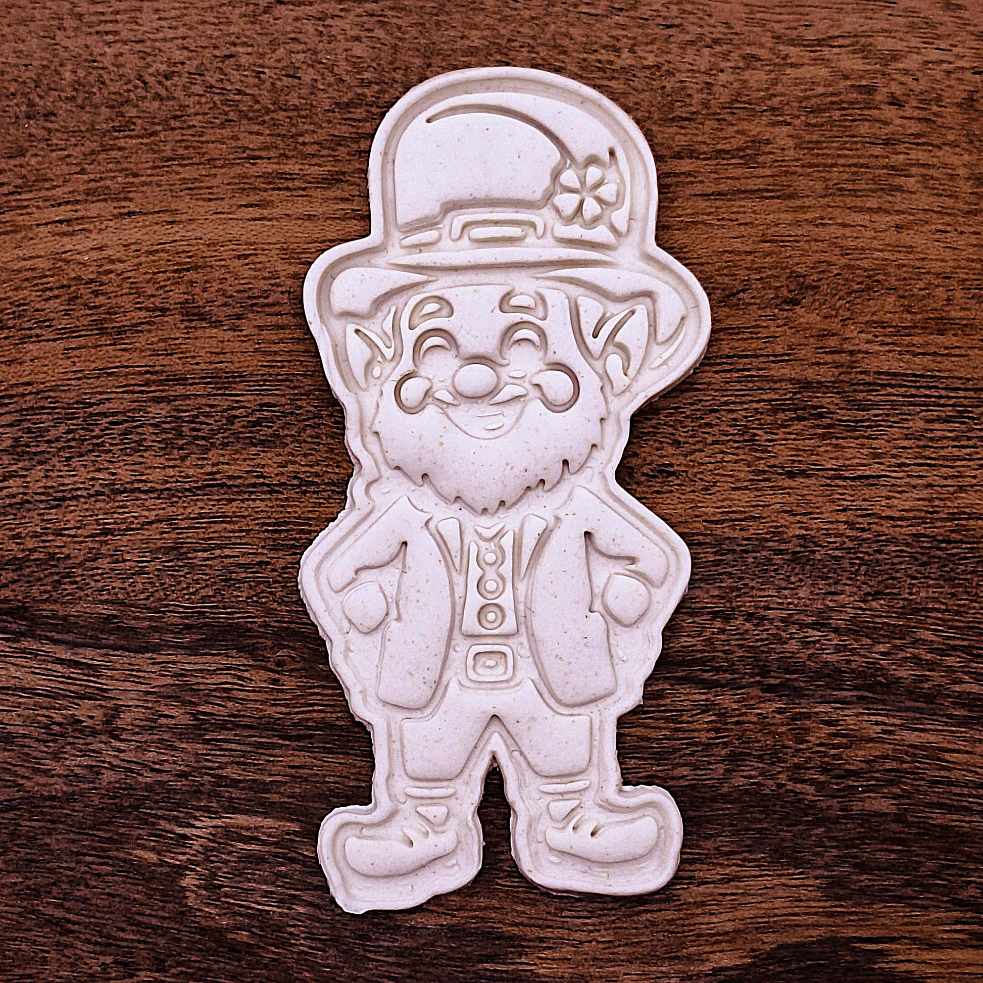 Stamped leprechaun cookie dough with hat, beard, and smile details. Perfect for holiday cookies or classroom treats.