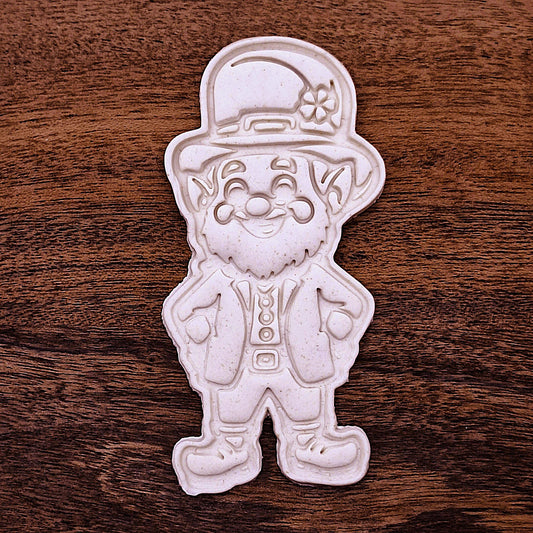Stamped leprechaun cookie dough with hat, beard, and smile details. Perfect for holiday cookies or classroom treats.