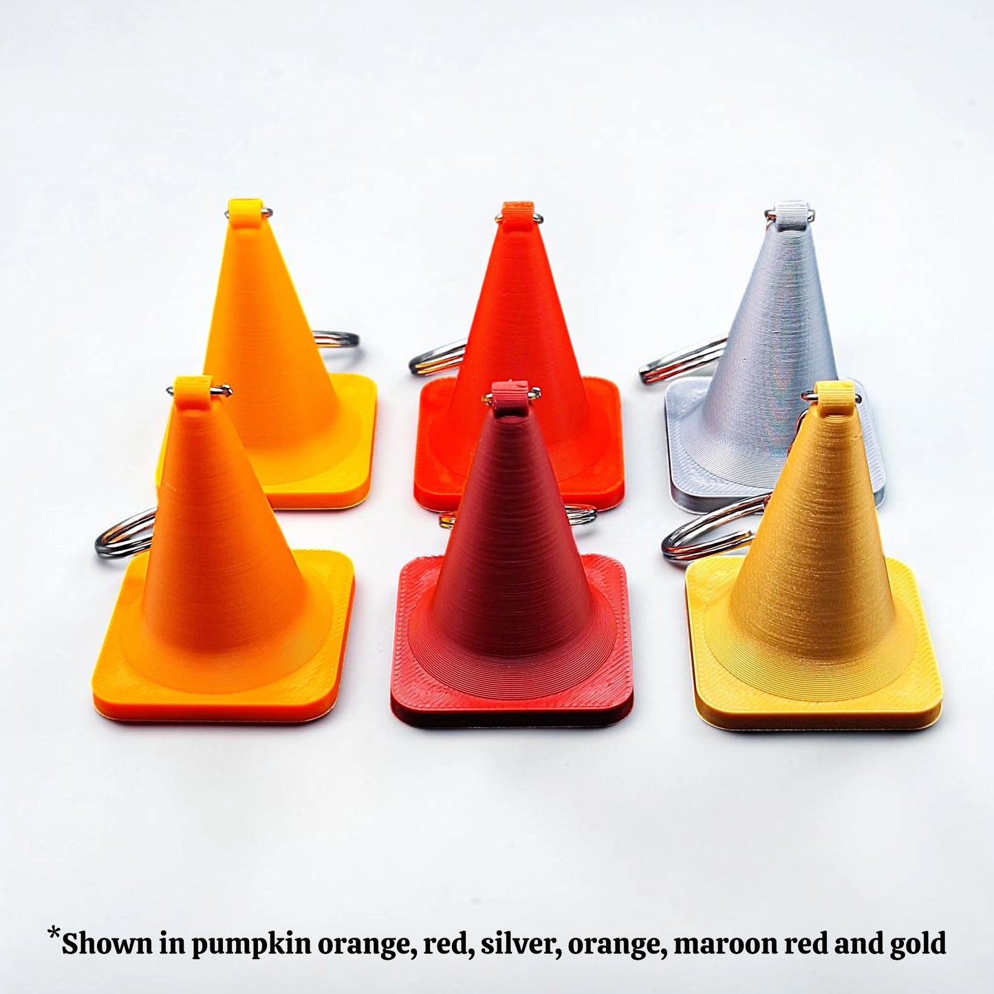 Colorful traffic cone keychains, showing detailed shape and eco PLA material, ideal for gag gifts or themed sets.