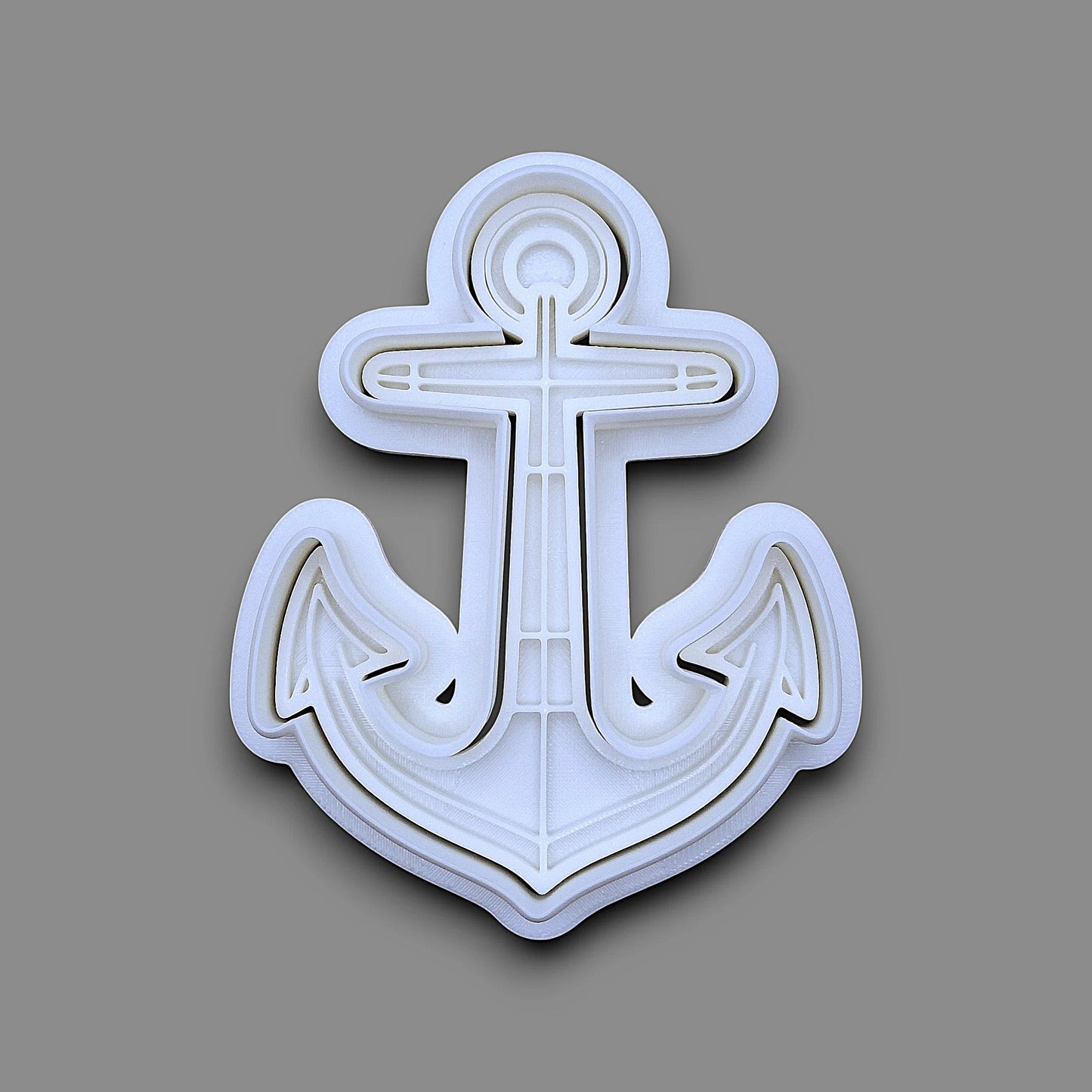 Anchor cookie cutter with matching stamp. Ideal for making detailed cookies, fondant toppers, or ocean party treats.