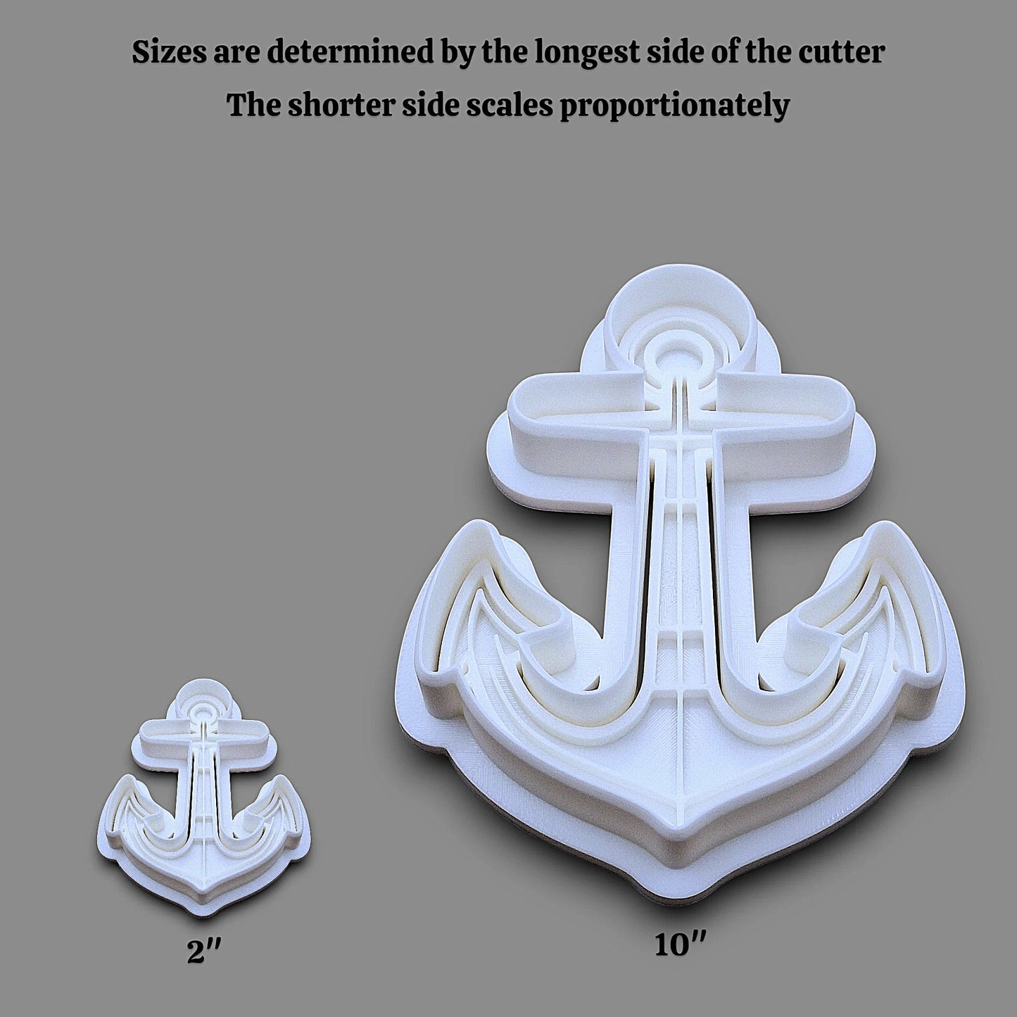 White plastic anchor-shaped cookie cutter shown in two sizes on a gray background, with text explaining that sizes are determined by the longest side and the shorter side scales proportionately. Labeled dimensions 2" and 10" appear below the cutters.