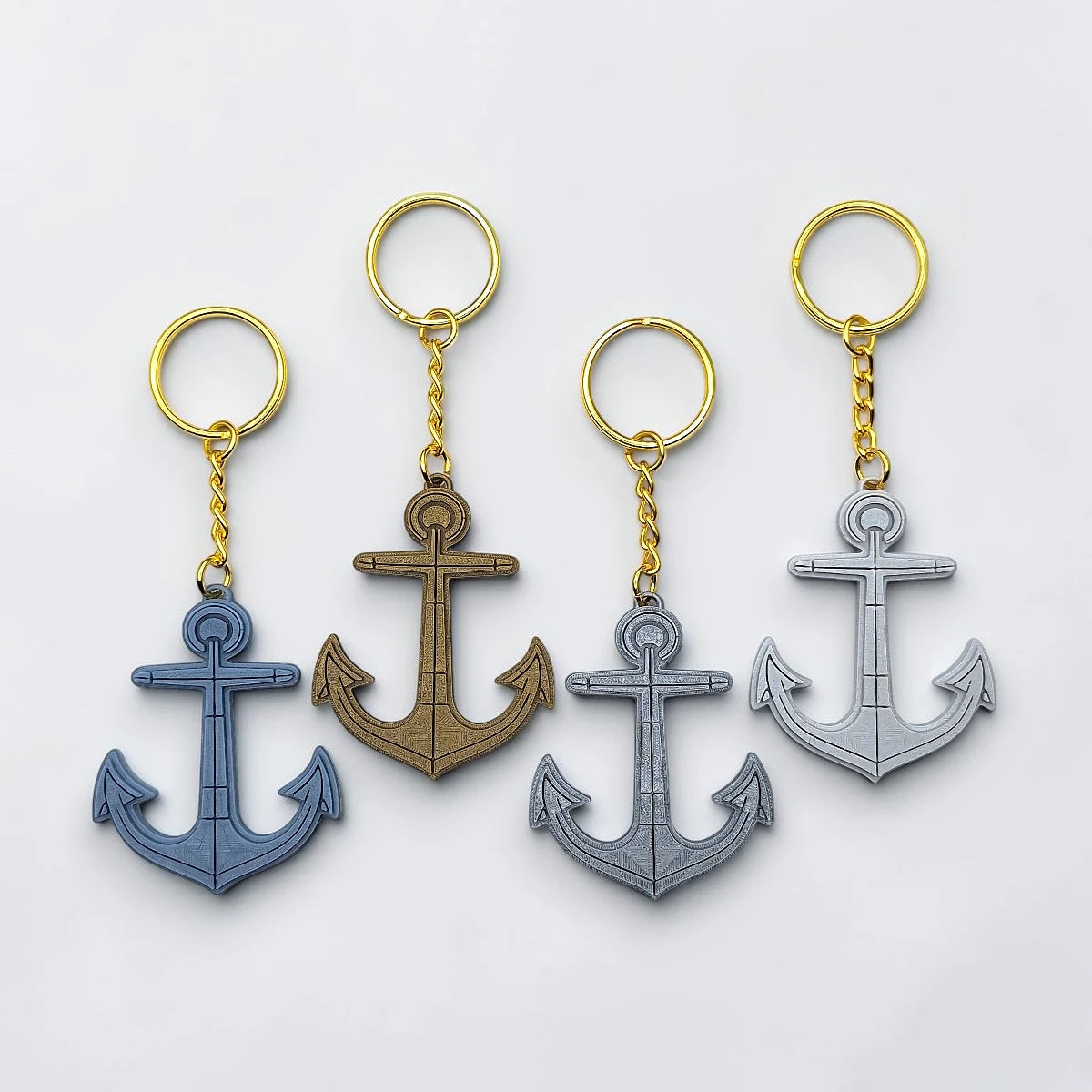 Eco-friendly handmade and customizable anchor keychains in multiple colors with gold keyrings, perfect nautical accessory for baby showers, boat lovers, coastal weddings, and beach-themed gifts.