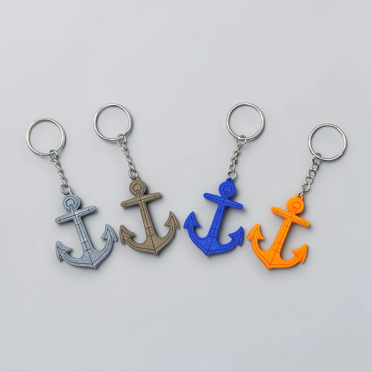 Eco-friendly handmade and customizable anchor keychains in assorted colors, perfect nautical accessory for baby showers, boat lovers, coastal weddings, and beach-themed gifts.
