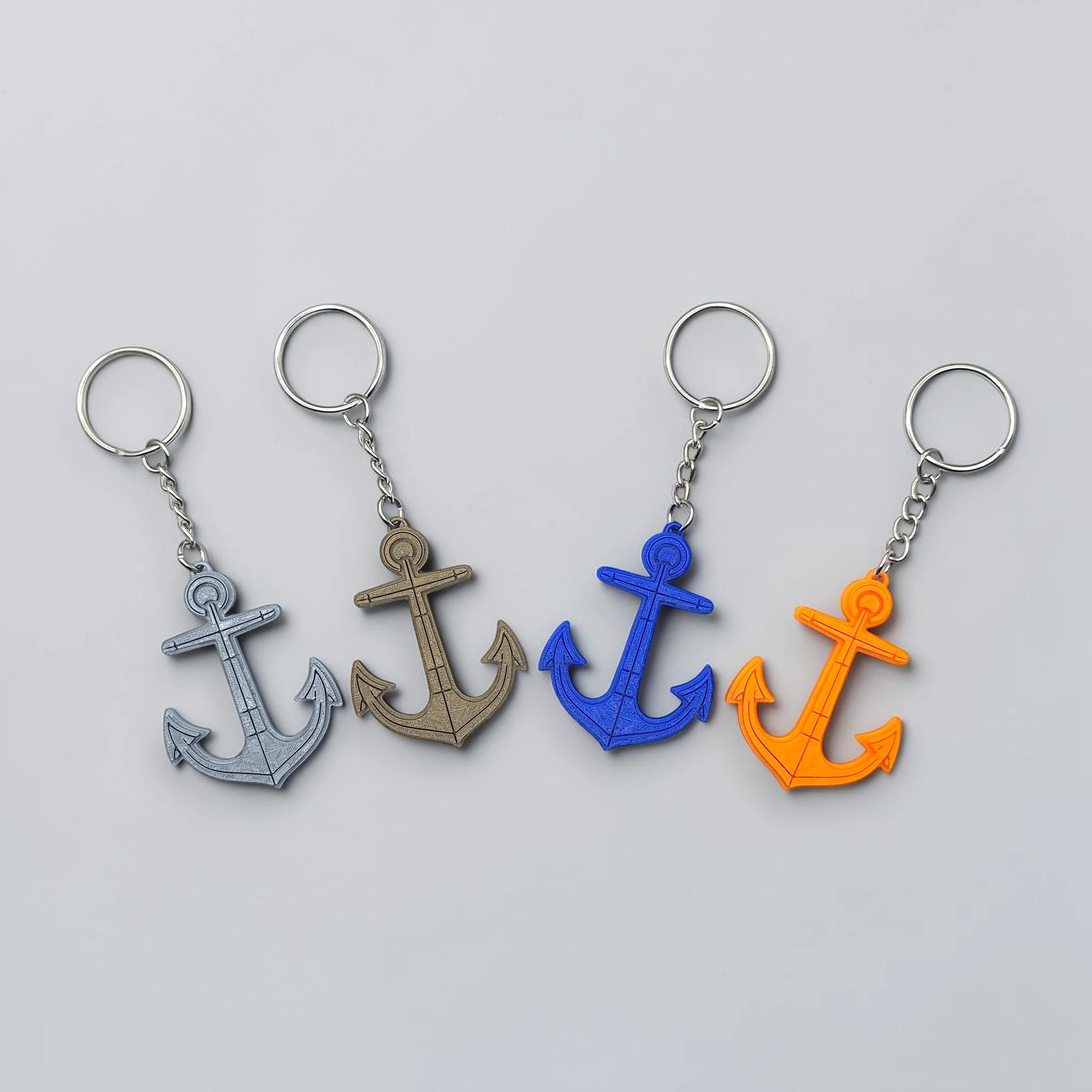 Eco-friendly handmade and customizable anchor keychains in assorted colors, perfect nautical accessory for baby showers, boat lovers, coastal weddings, and beach-themed gifts.