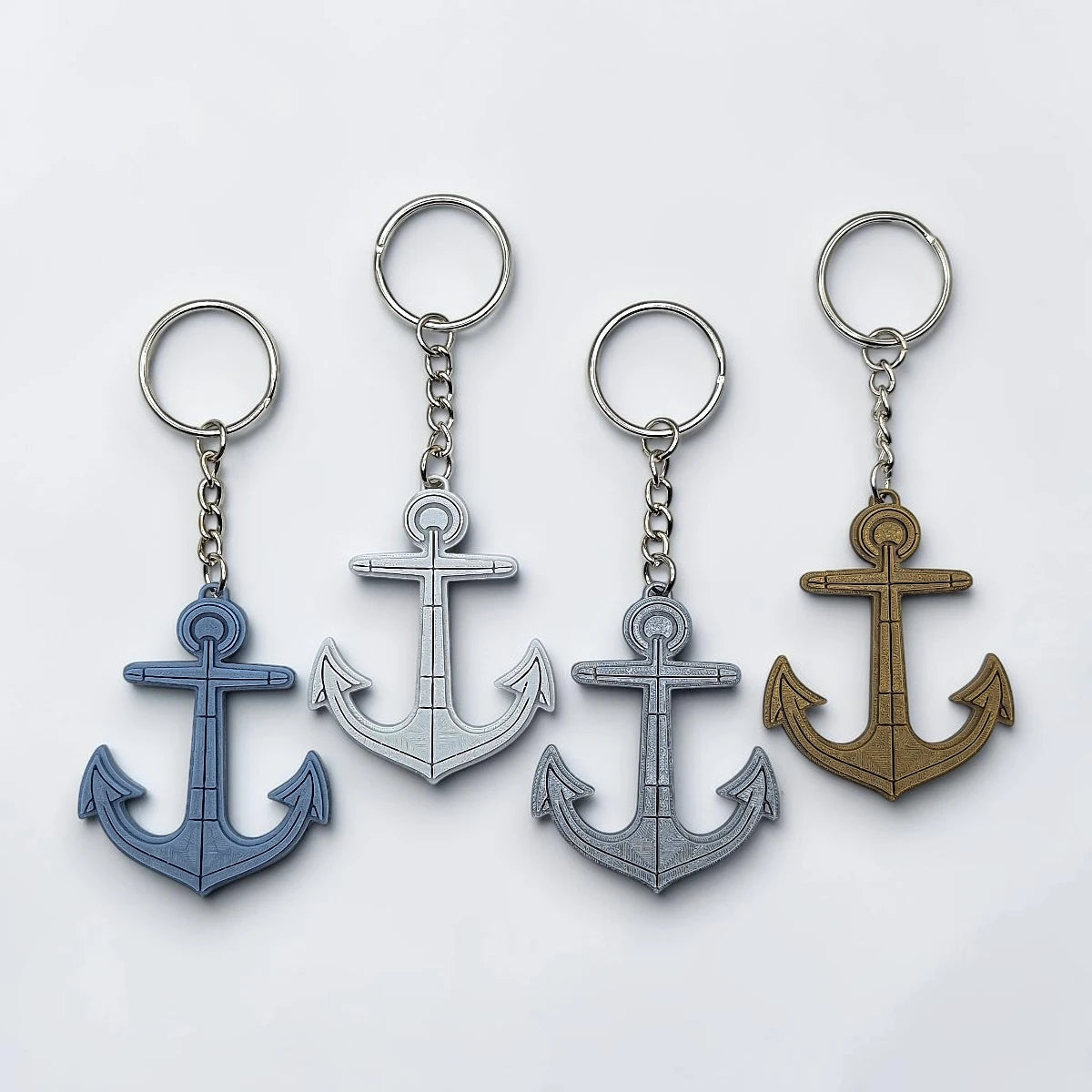 Eco-friendly handmade and customizable anchor keychains in unique colors, perfect nautical accessory for baby showers, boat lovers, coastal weddings, and beach-themed gifts.