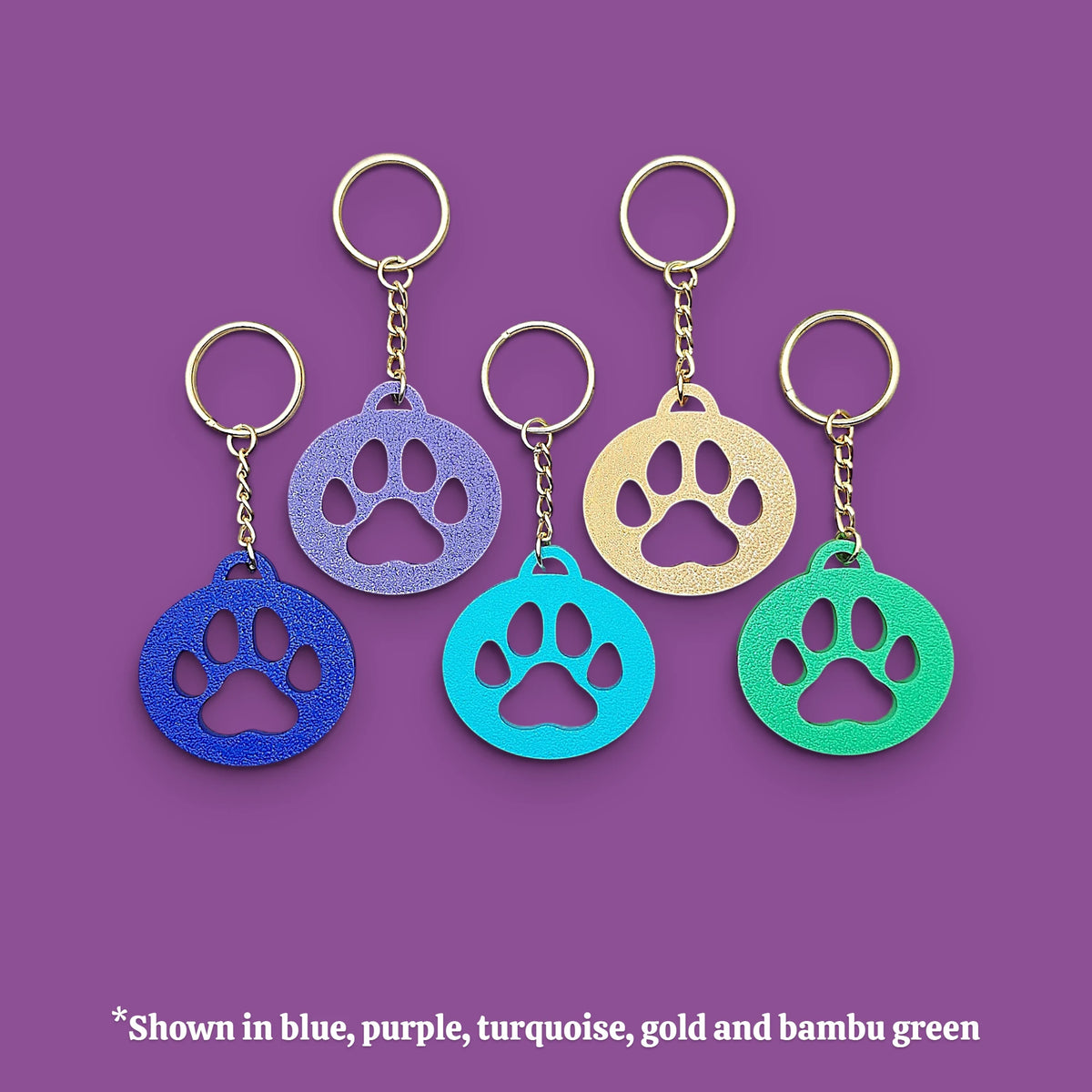Paw print keychain with silver keyrings, perfect for dog moms, cat lovers, rescue volunteers, shelter giveaways, and vet clinics. Handmade and customizable in 30 unique colors.