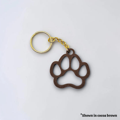 Handmade and customizable paw keychain in cocoa brown, ideal for honoring pets, gifting to animal lovers, or everyday use.