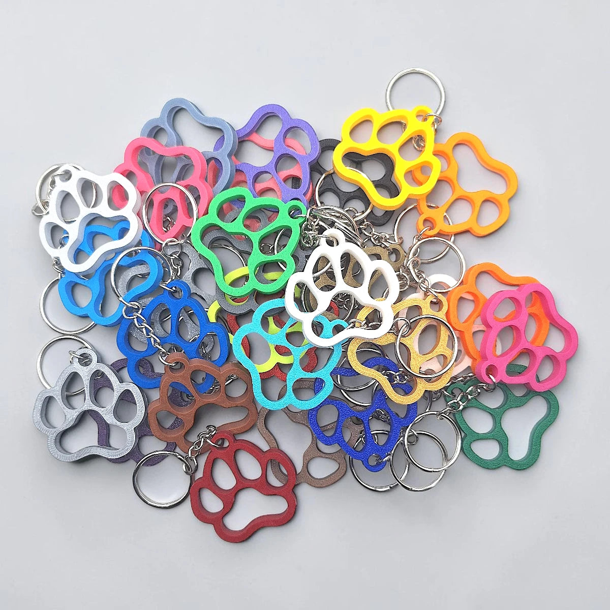 Paw keychains with clean silhouette, eco-friendly and handmade, ideal for honoring pets, gifting to animal lovers, or everyday use.