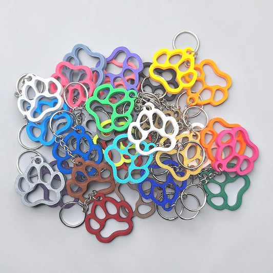 Paw keychains with clean silhouette, eco-friendly and handmade, ideal for honoring pets, gifting to animal lovers, or everyday use.