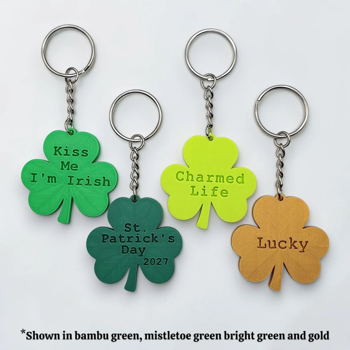 Personalized and engraved Shamrock keychains in multiple colors showing a classic three leaf clover shape, perfect for Irish gifts, St. Patrick's Day events, giveaways and family reunions.