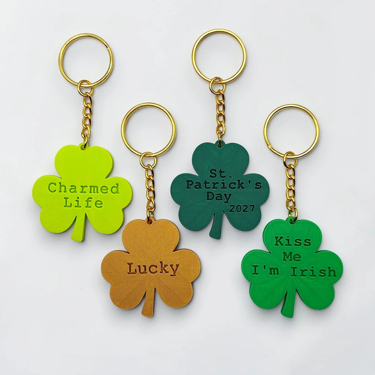Personalized and engraved Shamrock keychains showing a classic three leaf clover shape, perfect for Irish gifts, St. Patrick's Day events, giveaways and family reunions.