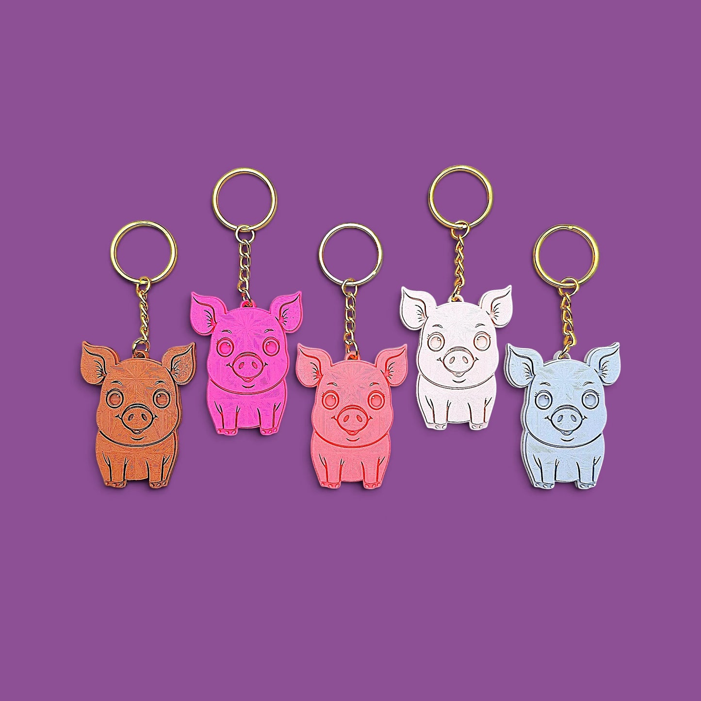 Handmade and customizable pig keychains in five colors with silver keyrings, great for country themed party favors, cute farm animal bag charms, and classroom prizes.