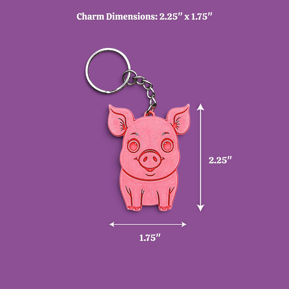 A pink pig-shaped keychain charm with a silver keyring, shown on a light gray background with dimension labels reading "2.25 x 1.75"