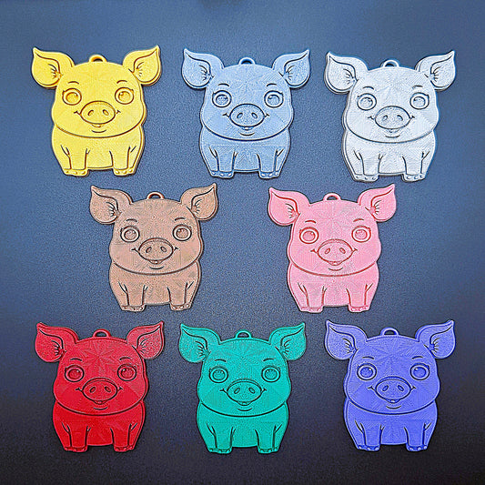 Front view of pig keychains in 8 bright colors; adorable handmade pig charms, perfect for farm-themed gifts, decor, and key ring collections.