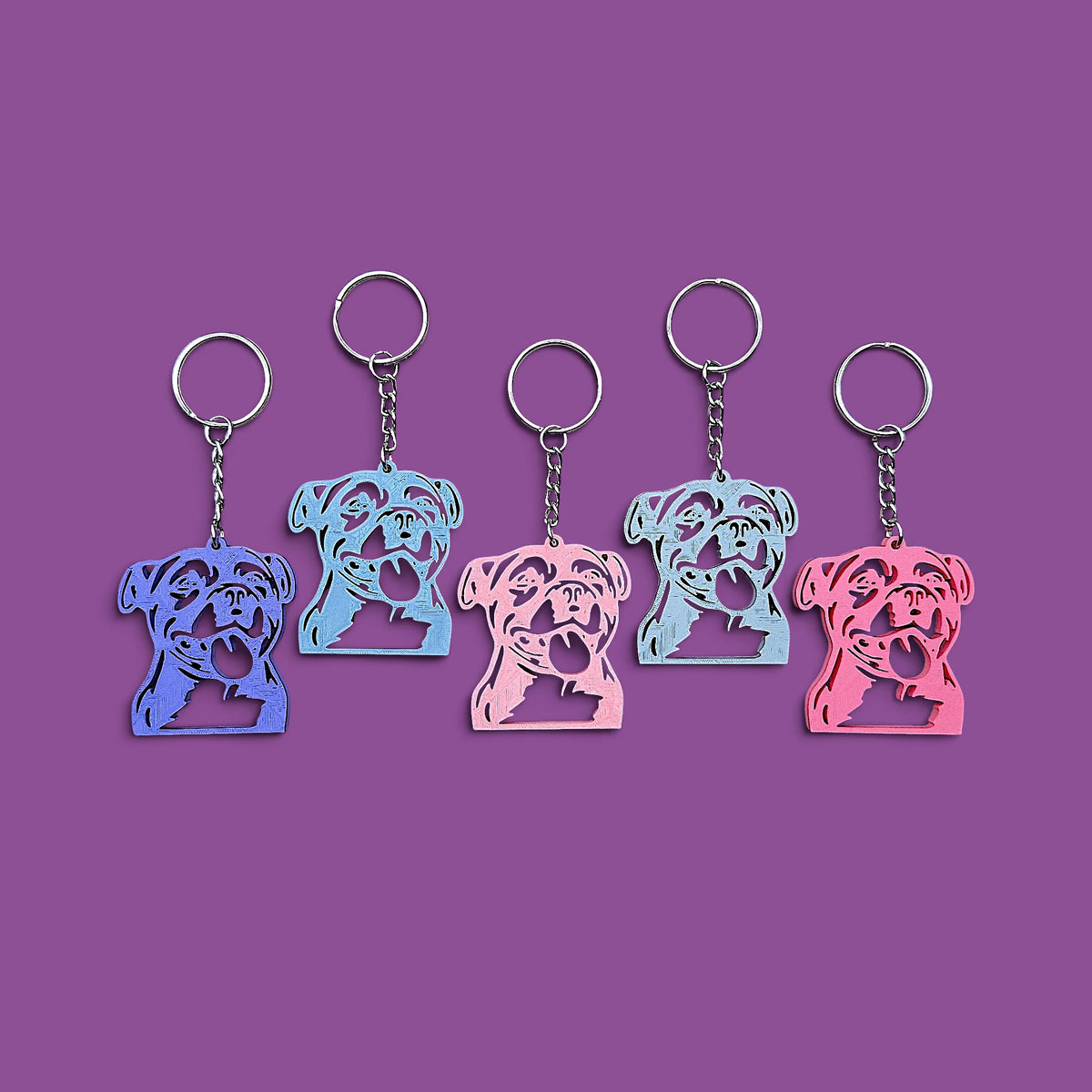 Handmade and customizable pit bull keychains, perfect for pittie owners, pitbull lovers, party favors, and unique bag charms.