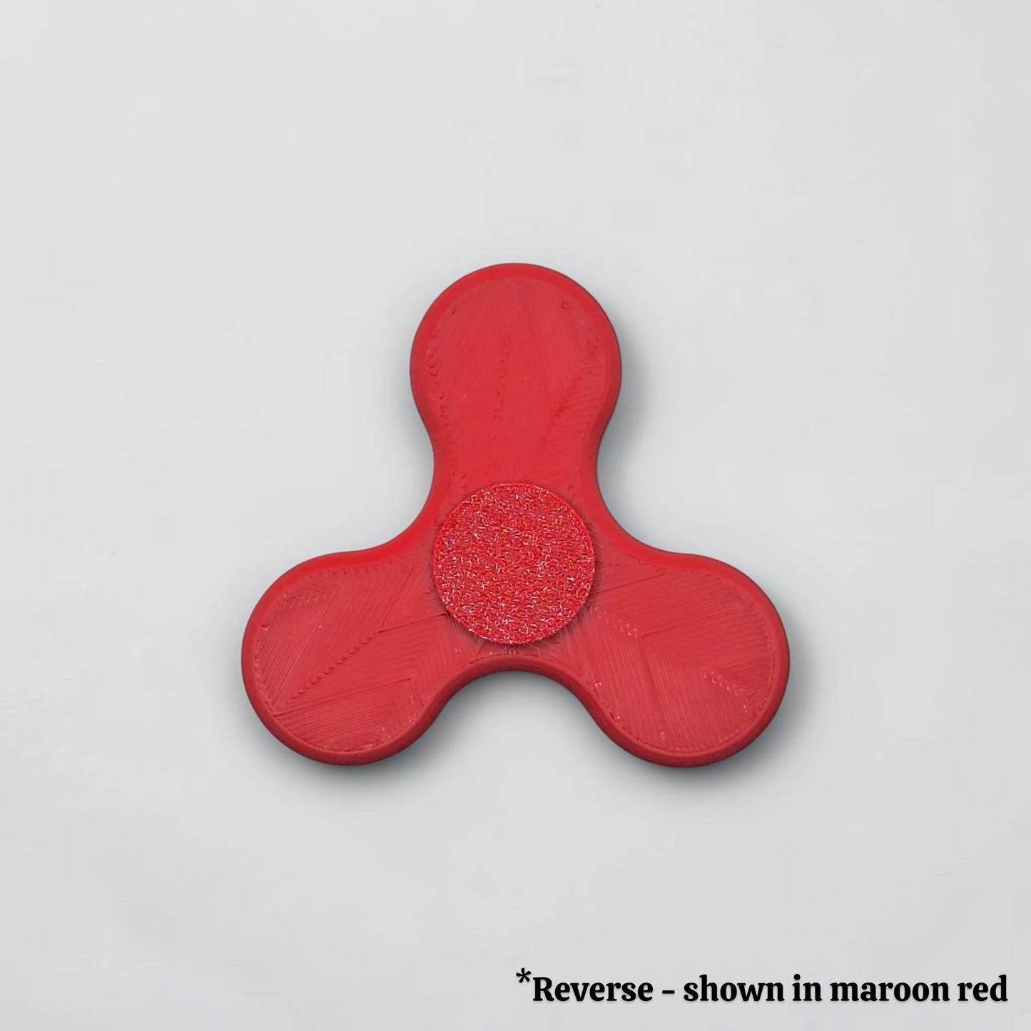 Reverse side of fidget spinner in red, perfect for party favors, birthday gifts and classroom rewards. Customizable in 30 unique colors.