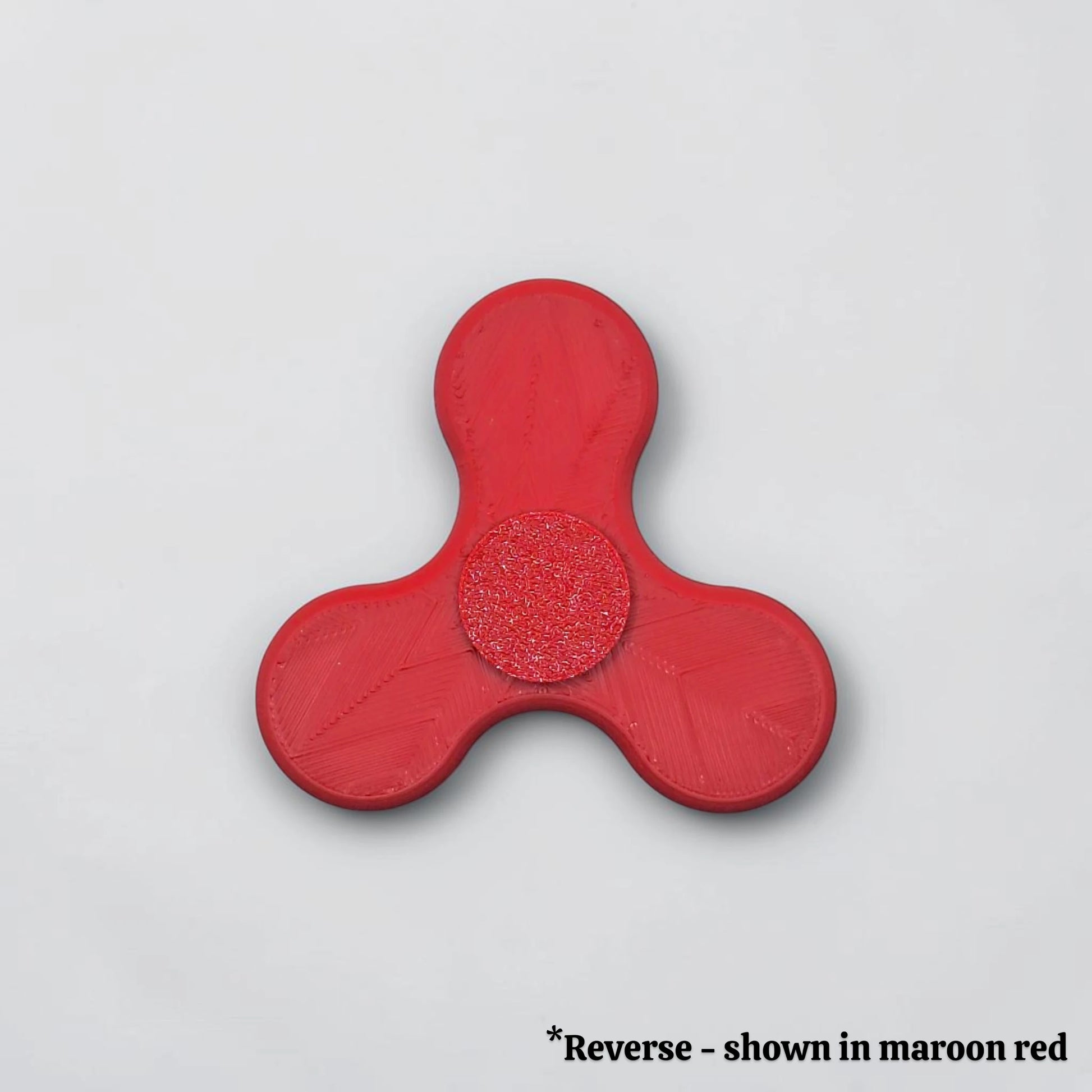 Reverse side of fidget spinner in red, perfect for party favors, birthday gifts and classroom rewards. Customizable in 30 unique colors.