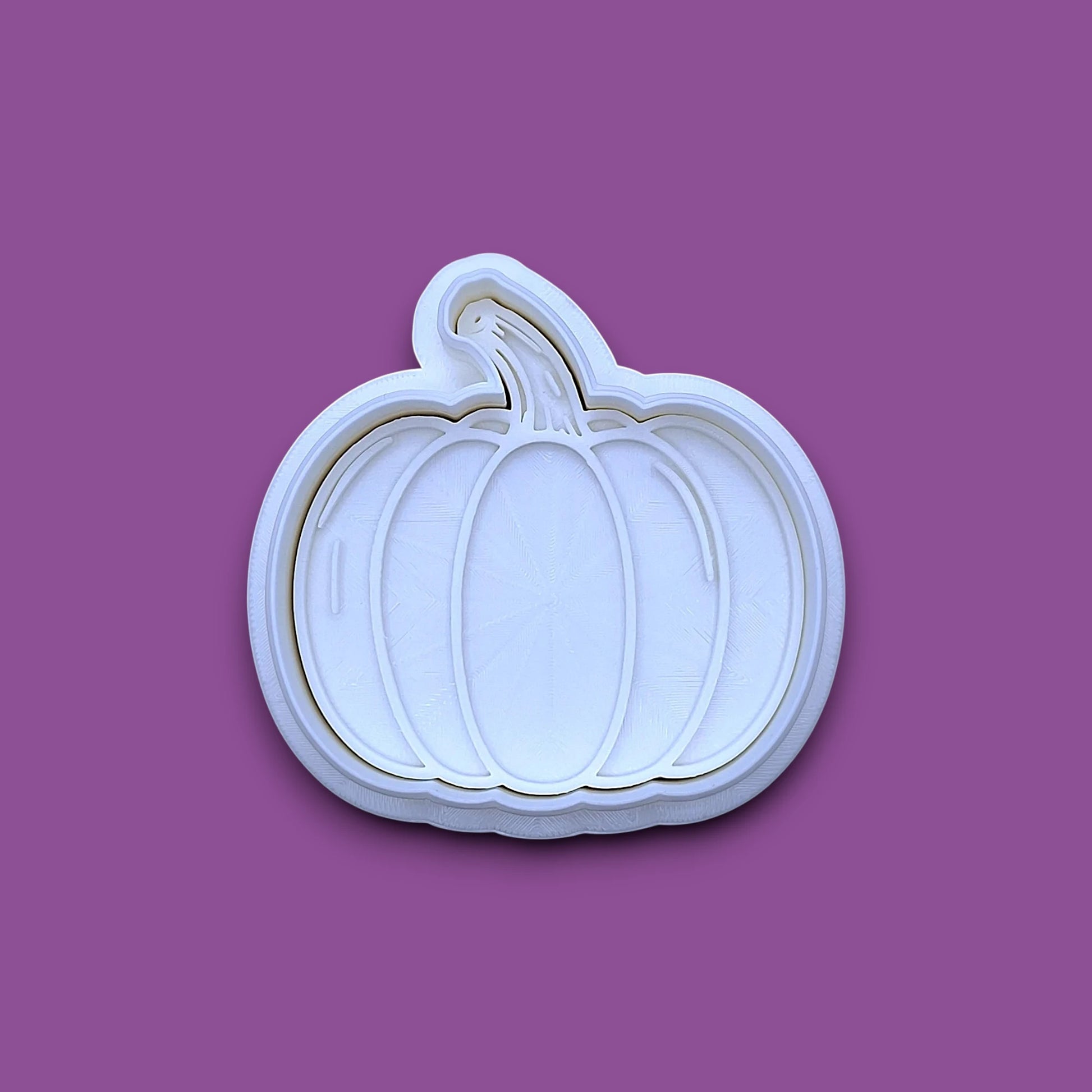 Customizable pumpkin cookie cutter and stamp, perfect for fall, Halloween, and Thanksgiving-themed baking or crafts.