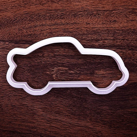 Racecar cookie cutter ideal for decorating, party favors, or themed events. Durable and detailed design for standout racecar cookies.