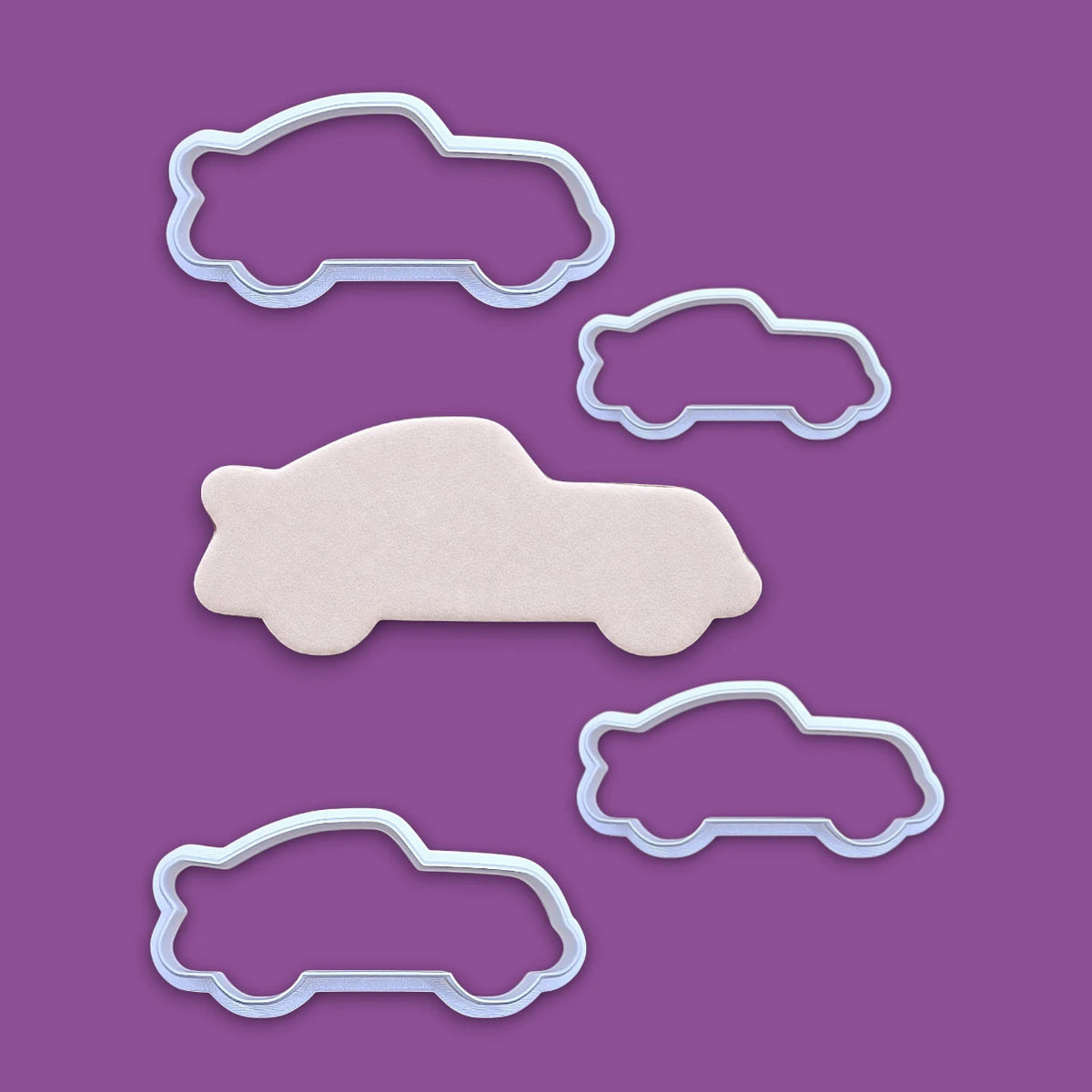 Racecar cookie cutters and dough cutout, perfect for racing-themed birthday treats, car cookies, or fun fondant decorations.