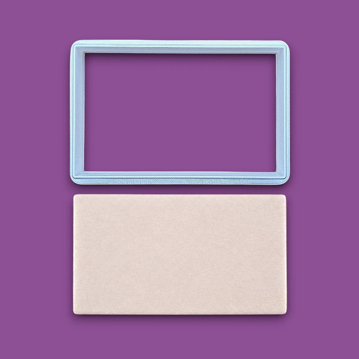 Rectangle cookie cutter alongside a dough cutout, perfect for baking classic shapes, fondant, parties, clay and crafts.