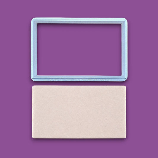 Rectangle cookie cutter alongside a dough cutout, perfect for baking classic shapes, fondant, parties, clay and crafts.