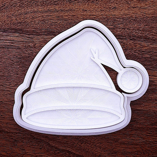 Santa hat cookie cutter with fluffy brim stamp detail. Great for party platters or fondant cupcake toppers.