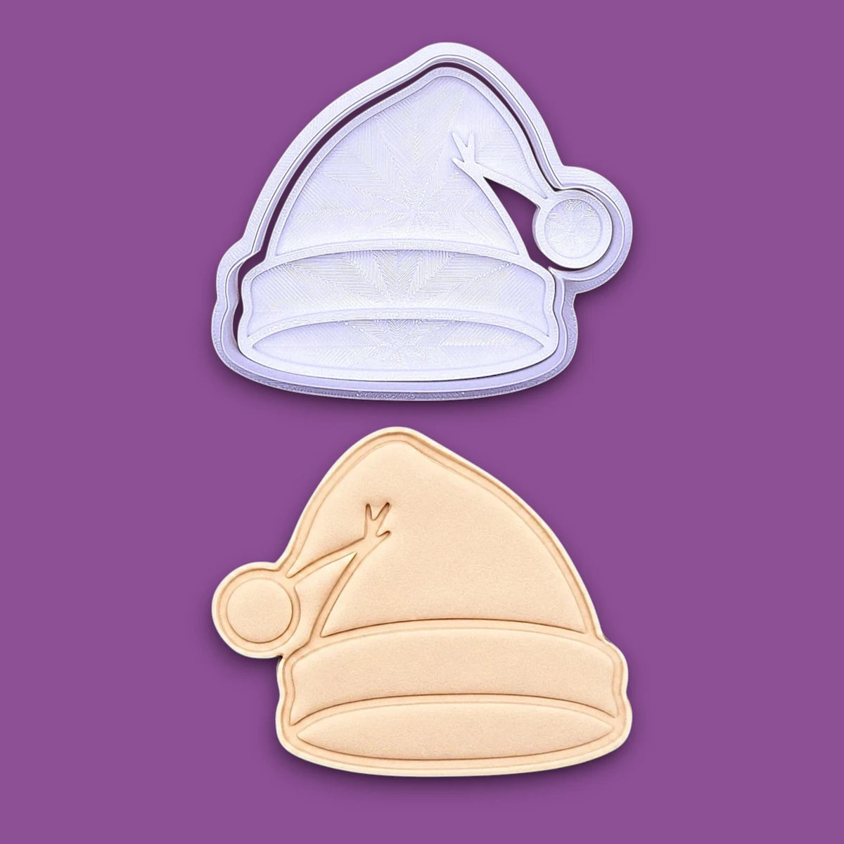 Santa hat cookie cutter and stamp and dough cutout and imprint, perfect for Christmas cookies, festive fondant toppers, or Xmas holiday crafts.