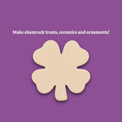 A single four-leaf clover-shaped dough cutout make from a shamrock cookie cutter.