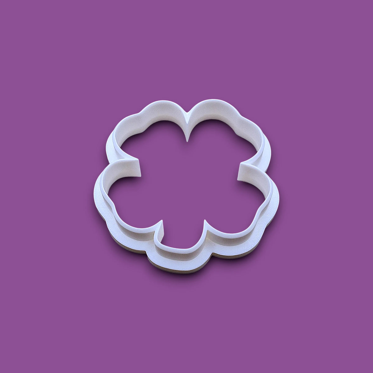 Four leaf clover shamrock cookie cutter, shown from a top-down perspective.