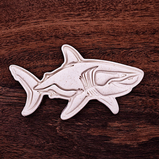 Shark cookie cutter with dough cutout imprint for ocean themed cookies, birthday treats, fondant designs, and fun baking projects.
