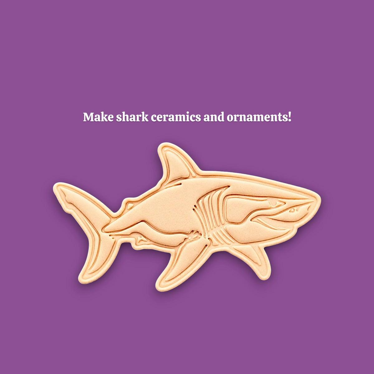 A shark-shaped ceramic or clay mold and template shown on a solid purple background, with the text 'Make shark ceramics and ornaments!' above it.