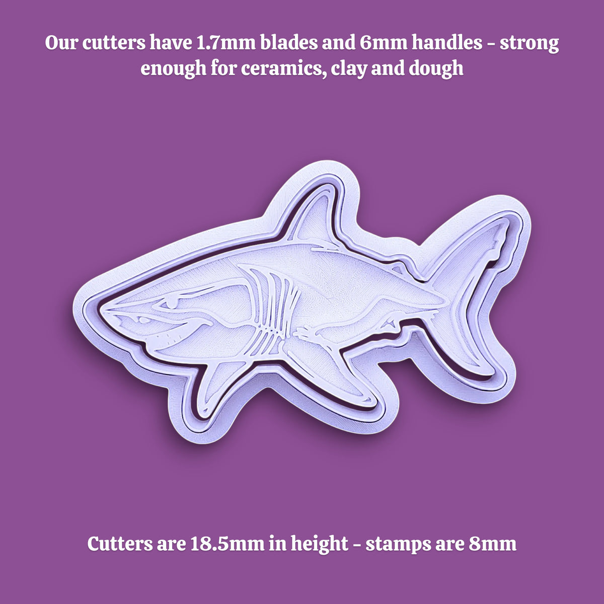 A shark-shaped cookie cutter with text overlays detailing the dimensions of the handle and cutting blade.